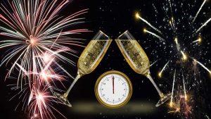 New year fireworks with midnight clock and champagne glasses
